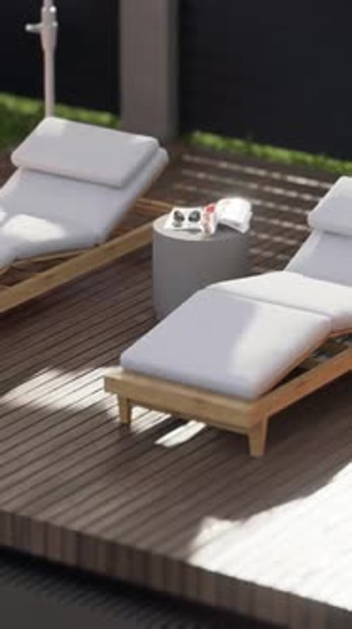 Exterior design details, close-up shot, two sun loungers by the pool.