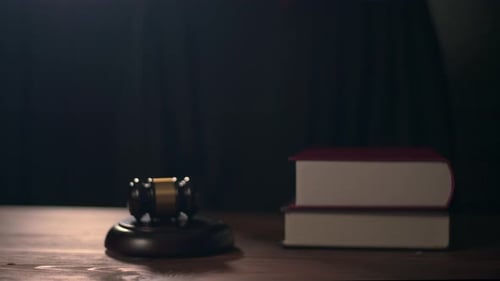 Close up of Judge hand is hitting hammer judge in courtroom