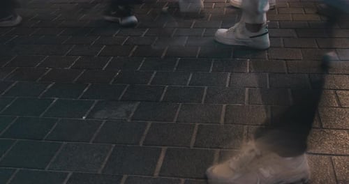 Footsteps on Textured Pavement with Gradual Movement Captured in Three Frames Showcasing the