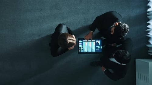 Top down view of manager shaking hand with team and analyze data. Directorate.