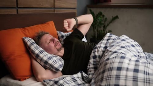 Man Waking Up In Morning