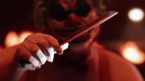 Creepy Clown Holding Cleaver Intimidating Close Up Shot
