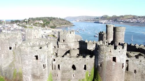 Medieval Conwy castle Welsh market town ruins aerial view historical blue sunny harbour