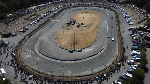 Aerial View of Stock Cars Racing on Track