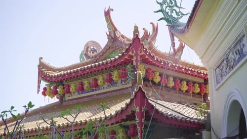 Pan of red decorated Buddhist temple in Kek Lok Si, Malaysia, daylight