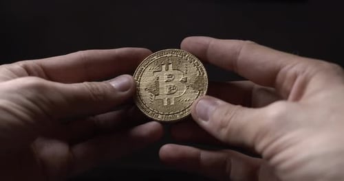 Hands Rotate Gold Bitcoin Cryptocurrency