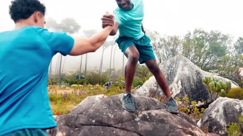 Mountain, hiking and men with help for fitness, training and exercise for adventure in nature