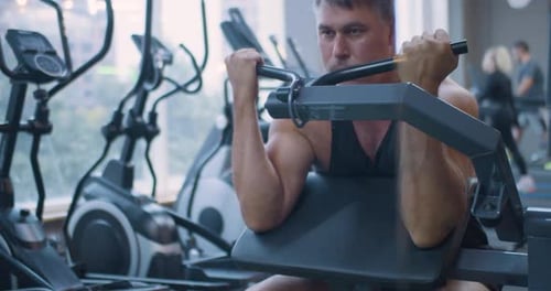Gym Workout Bicep Exercise Middle Aged Caucasian Man Trains His Bicep Muscles in the Gym