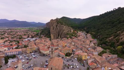 Aerial view of French village Les Mees and iconic limestone spires