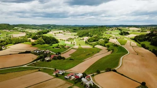 Aerial View of Rolling Hills and Rural Farmland