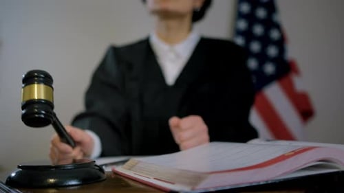 Judge Bangs Gavel in Courtroom