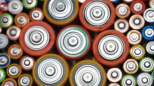 Rows of Used Alkaline AA AAA D Batteries Lithium Ion Battery Pack Close Up