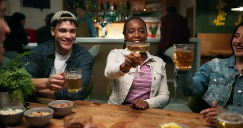 Laughing, friends and cheers with beer in bar for reunion celebration, social gathering and night