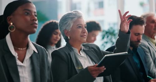 Business People Listening in a Corporate Meeting