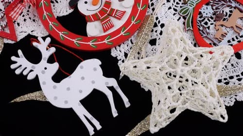 Festive Christmas decorations close-up. Wooden ornaments on crochet background.