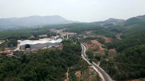 Winding Road in Vietnam Near an Industrial Area Between the Mountains on the Outskirts of the City
