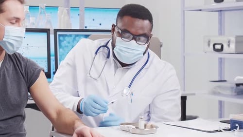 Healthcare Provider Giving Injection in Clinic