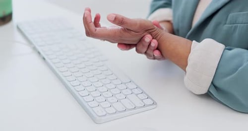 Computer keyboard, hands and business person with carpal tunnel syndrome
