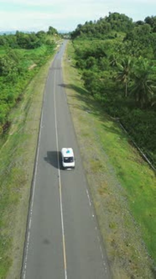 Aerial View of Road Through Tropical Landscape