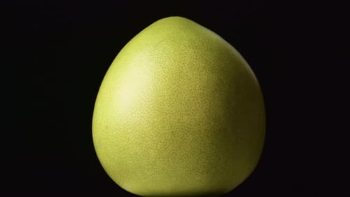 Citrus fruit Pomelo on black background.