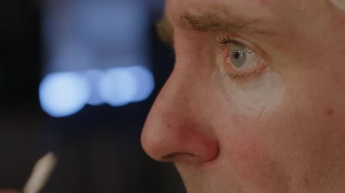 Close-Up of Face of Male Circus Artist Doing Clowns Make-Up
