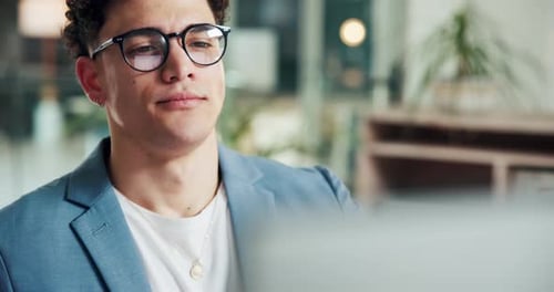 Young Man Working at Desk in Modern Office