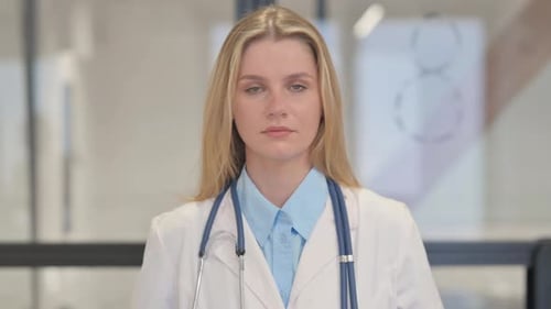 Blonde Woman Doctor with Stethoscope Looking Ahead