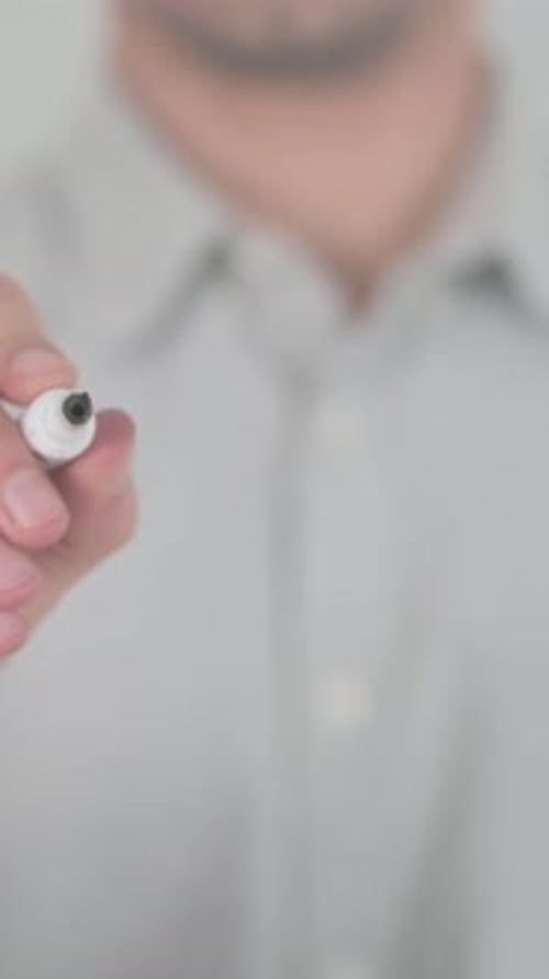 Hand Writes the Word "Power" on Glass