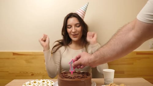 Excited Woman Celebrates Eighteenth Birthday With Cake
