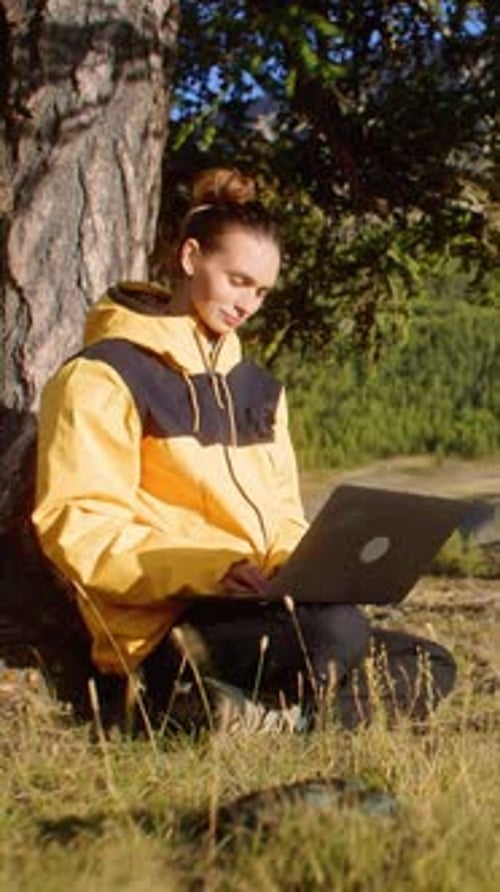 Enjoy Remote Work in Nature Using a Laptop While Surrounded By a Stunning Mountain View