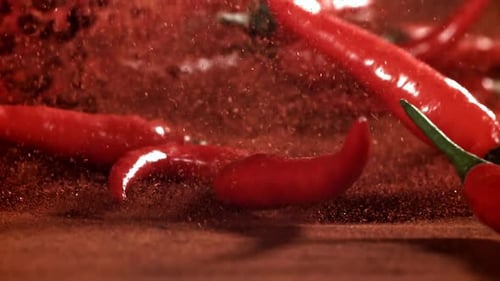 Red Chili Pepper in Flight with Ground Pepper Filmed on a Highspeed Camera at 1000 Fps