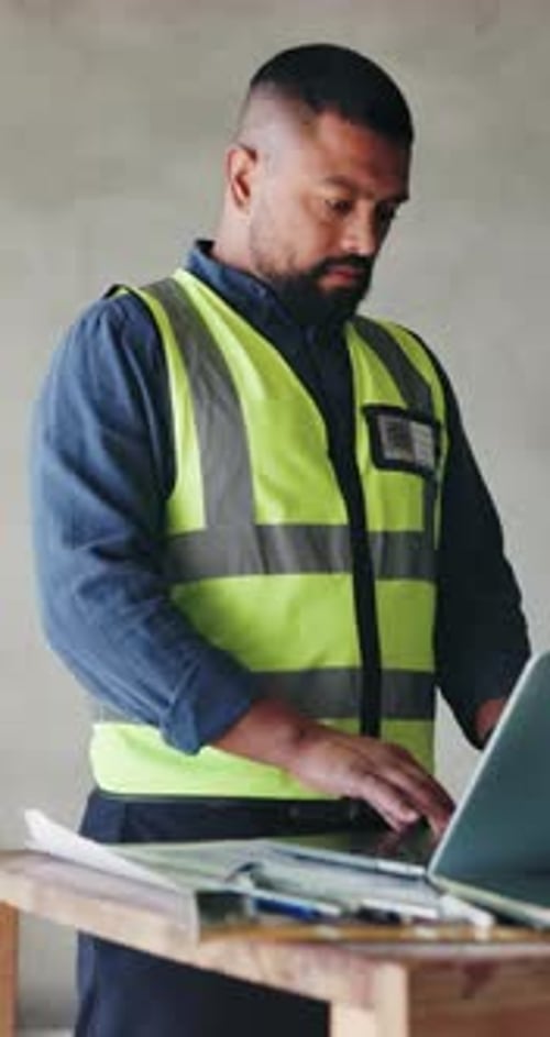 Laptop, man and construction worker in office typing for material delivery for renovation