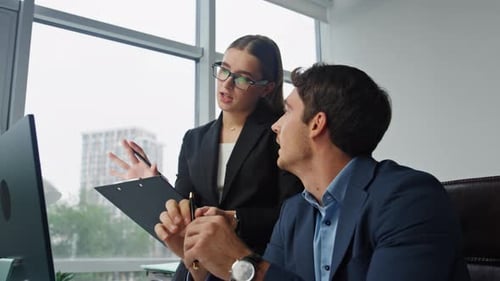 Professional Managers Planning Project in Office Together