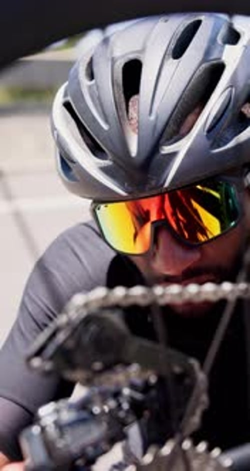 Man, bicycle repair and exercise in city with inspection for chain, gear