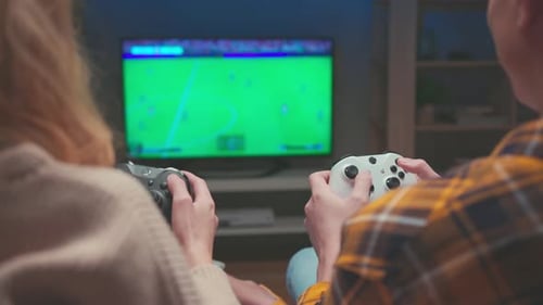 Couple Playing Video Games Together at Home