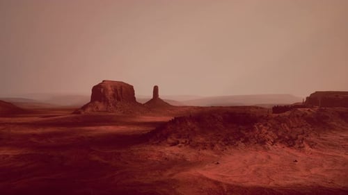 Desert Landscape with a Majestic Rock Formation in the Distance