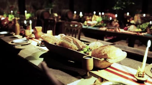 Rustic Medieval Feast Table with Candles and Bread