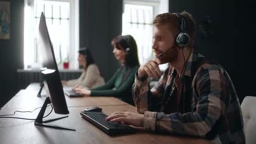 Man Working at Computer in Corporate Office