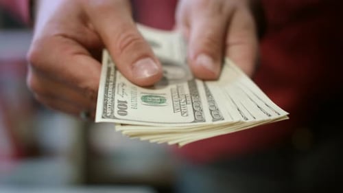 Man Hands Showing Dollar Banknotes. Close Up Of American Cash Money In Male Hands. Man Showing Fa...