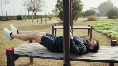 Man Does Intense Exercise Using City Park Structures