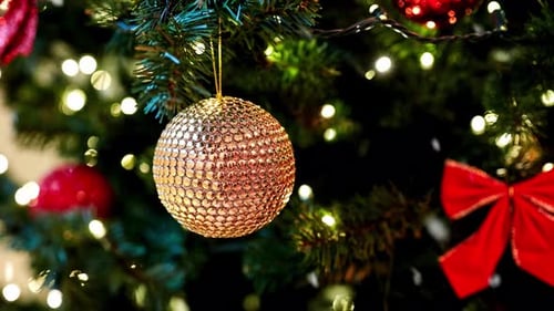 Festive Christmas Tree with Gold Ornament and Lights