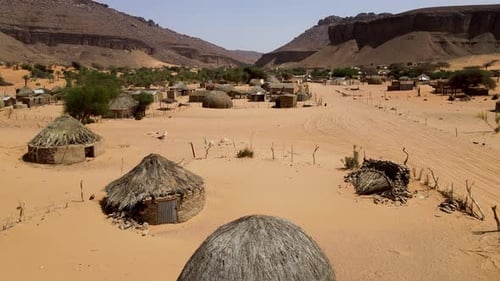 Rural Thatch Huts in Terjit Oasis in Poverty-Stricken Village, Mauritania - Aerial Drone View