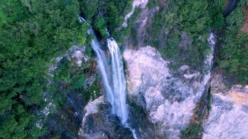 Aerial View Waterfall of Mountain Falling in Green Nature of Forest Landscape