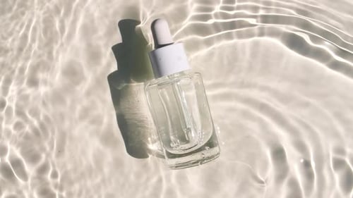 Clear Glass Bottle in Fresh Rippling Water