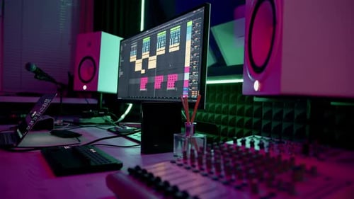 professional sound recording studio sound engineer or music producer sitting at the remote control