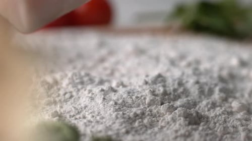 Raw Fish Slices Falling into Flour for Cooking