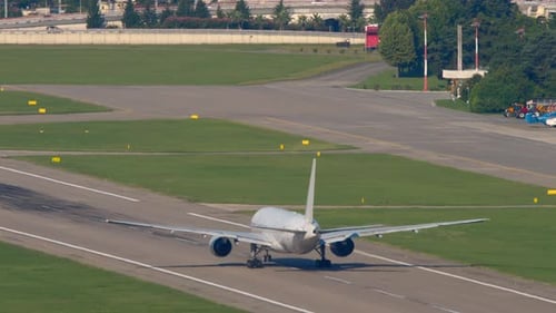 Airplane Landing on Runway During Daytime