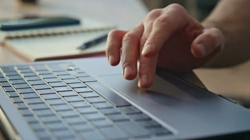 Freelancer Scrolling Touchpad Laptop Working Online at Remote Workplace Close Up
