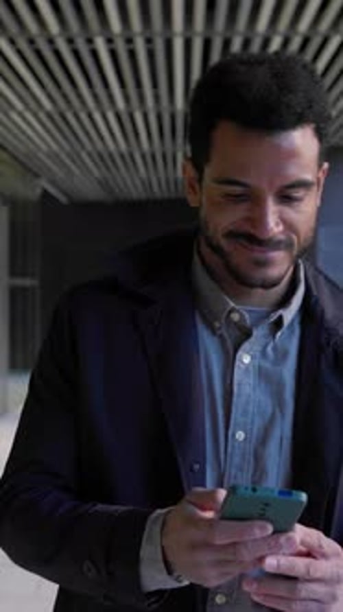 Man Using Smartphone in Urban Setting