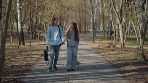 Youth Stroll Park Teenagers Wander Through Green Space Happily Young People Casually Walk Park